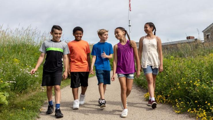 5 children walk a path at Historic Fort Snelling