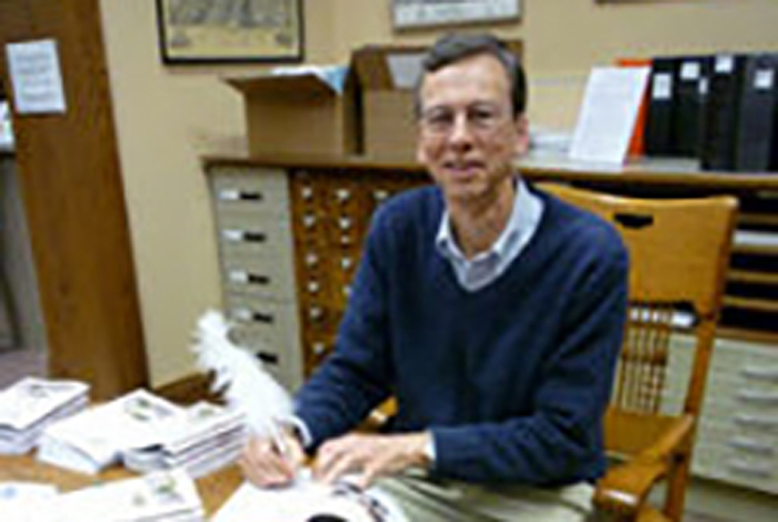 An author is signing a book.