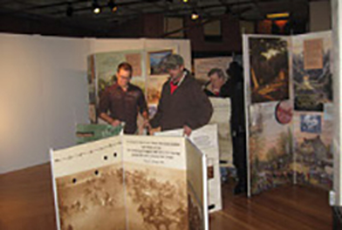 People are setting up an exhibit.