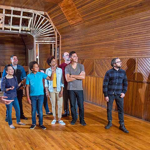 Group in large paneled room
