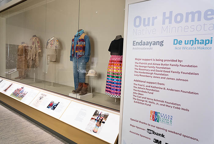 Photo of exhibit title and clothing wall