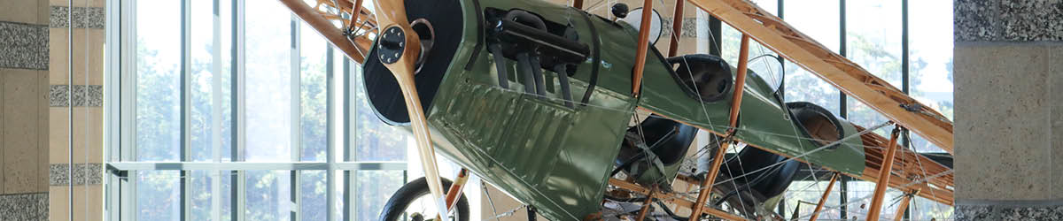 The Jenny airplane suspended from the ceiling of the Minnesota History Center.