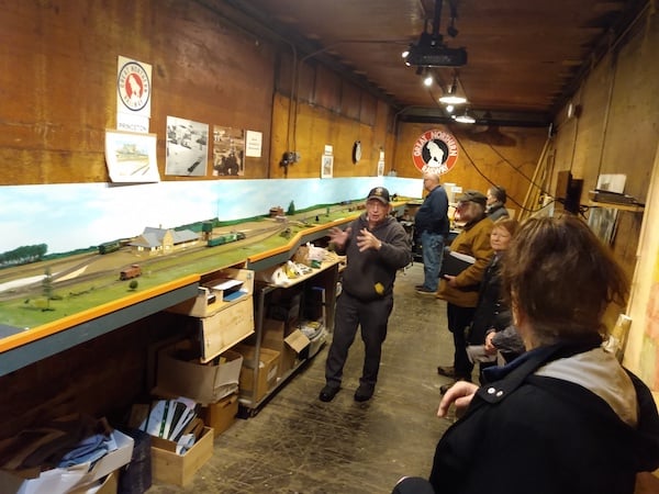 Central Minnesota Regional History Group getting tour of exhibits in the Mille Lacs County Historical Society’s depot museum