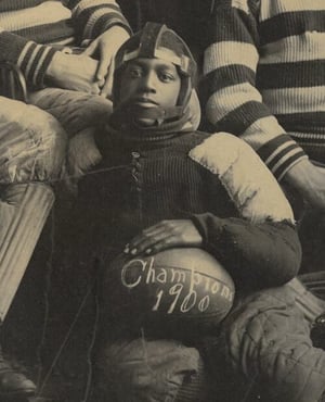 ca. 1910 photo of a young African American man holding photo