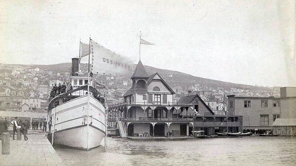Duluth Boat Club with the vessel known as Ossifrage at the Sixth Avenue West dock in Duluth, Minnesota in 1888