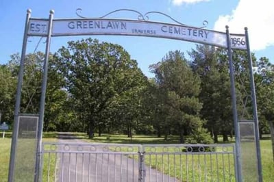 Metal archway and gate into Greenlawn Cemetery