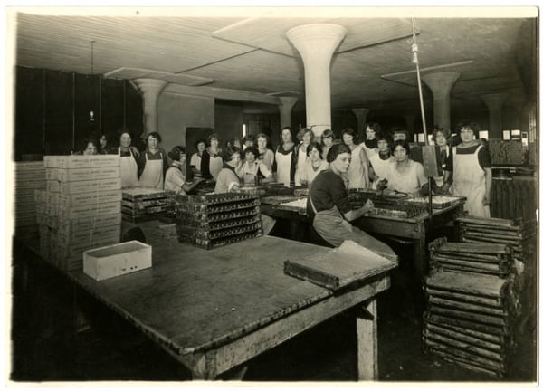 Workers in the workroom where chocolate covered caramels are being made. ca 1915