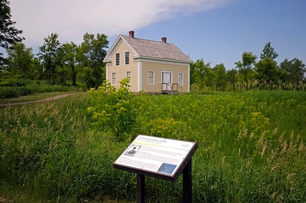 Bottineau House Exterior - from Trail showing wayside signage