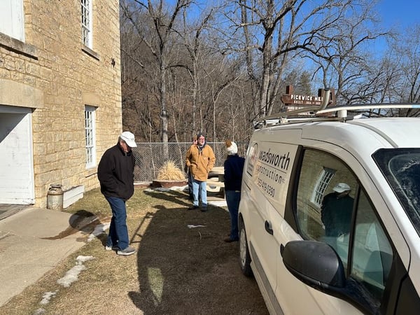 People and vehicle outside of the Pickwick mill