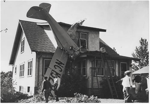Plane crashed in to roof of house