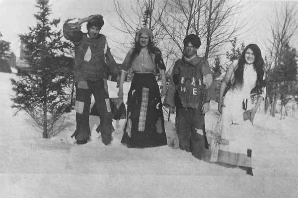 People in costume going to a costume or hard times dance