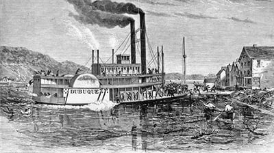 Black and white illustration of the steamboat "Dubuque" on a river, with passengers on deck, swimmers in the water, and buildings along the shore.