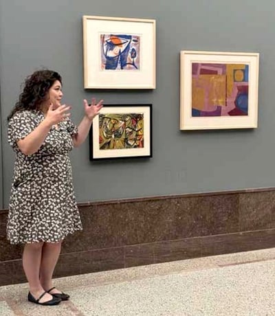 Kylie Linh Hoang gives a talk about Seong Moy in front of one of his artworks
