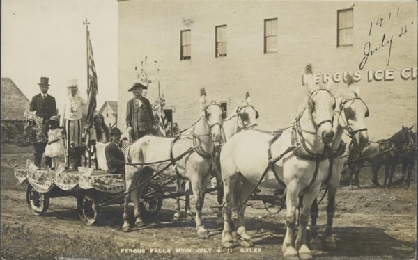 Patriotic float featuring Abe Lincoln, Lady Liberty, Uncle Sam George Washington, a little girl and an eagle from the July 4, 1911 Independence Day parade in Fergus Falls