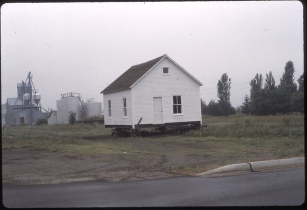 Schoolhouse being moved by the Mille Lacs County Historical Society-1982