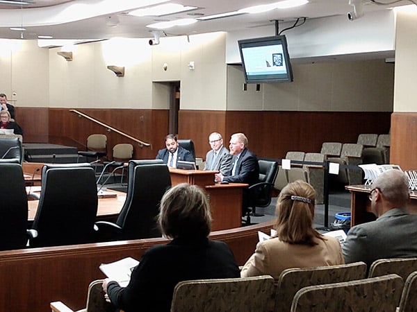 Kent Whitworth, Avi Viswanathan and David Kelliher sitting at table testifing before the MN House Legacy Finance Committee
