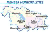 Color map depicting the cities that lie along the path of Ȟaȟá Wakpádaŋ (Bassett Creek). Bodies of water are blue, and each city is depicted in either yellow, orange or pink to distinguish against other city boundaries.