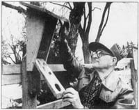 Dick Peterson with one of his bluebird nest boxes, 1991