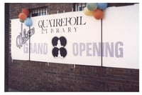 Quatrefoil Library grand opening banner