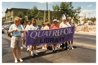 Quatrefoil Library volunteers march during Pride in Minneapolis, 1988