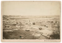 Black and white photograph of the lower West Side and Wabasha Bridge, c.1885.