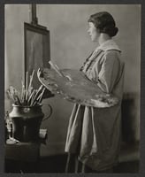 Black and white photograph of Elsa L. Jemne working at an easel, 1922.