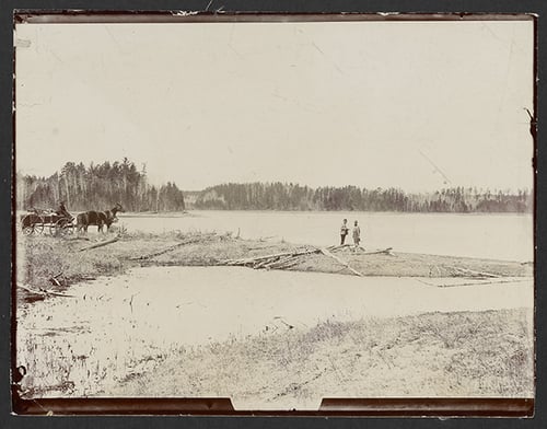 Black and white photograph of Jacob Brower at the Lake Itasca basin at DeSoto Lake, 1889.