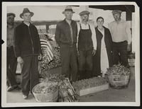 Black and white photograph of farmers who braved the picket lines to reach the Minneapolis city produce market during the truckers' strike, 1934. Photograph by the Minneapolis Tribune.