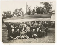 Norwegian Minnesotans posed for a picture with a sloop (boat).