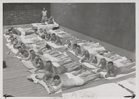 Black and white photograph of sun bathers on the sun deck of the St. Paul Athletic Club, c.1935.