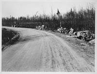 Black and white photograph of wrecked cars along Pike Lake Road near Duluth, 1918.