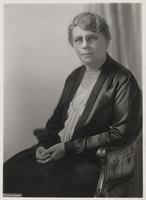 Black and white photograph of Frances Densmore seated, 1928.