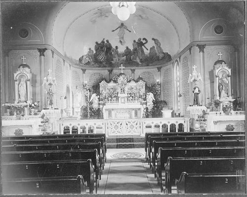 Photograph of the altar and main aisle of St. Peter Claver