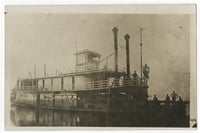 Black and white photograph of the Sea Wing, c.1889. Its owners typically used it as a work boat, often towing log rafts down the Mississippi.