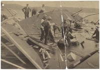 Black and white photograph of rescue workers searching for bodies in the wreckage of the Sea Wing, 1890.