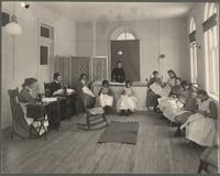 Black and white photograph of sewing class at the State School, c.1905.