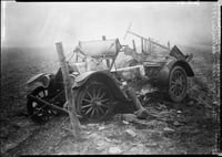 Black and white photograph of the ruins of a car after fire, Kettle River Road, 1918.