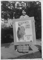 Photograph of Wanda Gág with a poster she submitted in a contest, 1914.