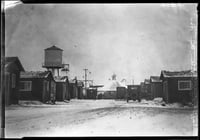 Black and white photograph of the main Street of the Milford Mining Company in Crosby, 1924.