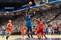 Sylvia_Fowles_(34)_puts_the_ball_up_as_shes_guarded_by_Myisha_HInes-Allen_(2)