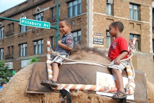 Children riding a camel in Minneapolis