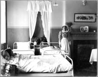 Nurse with patient in Fergus Falls State Hospital