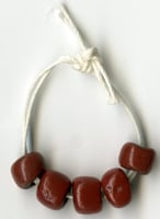 Color image of dark red trade beads.