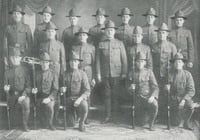 Black and white photograph of corporals in military drill squad, 1918.