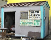 Color image of Store specializing in “do-it-yourself products” owned by Tiger Jack Rosenbloom, 2002. The structure stood at the corner of Dale Street and St. Anthony Avenue in the Rondo neighborhood of St. Paul between 1949 and 2002.