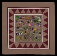 Color image of a Hmong story cloth (paj ndau) showing a traditional Laotian village scene. Made in Ban Vinai, Thailand, c.1989.