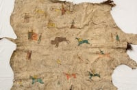 Buffalo robe painted with human figures, horses, and buffalo. Made by Dakota during the late nineteenth century.