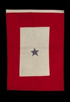 Color image of a red and white felt service flag with one blue star, used by the family of Harvey Mears, who served in World War I and World War II, ca. 1915–1943.