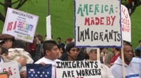 Color image of demonstrators gathering in St. Paul to show their support for immigrants’ and immigrant-workers’ rights, 2006. Photographed by Mary Turk.