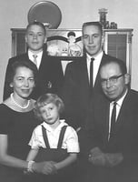 Black and white photograph of Ernotte and Ardis Hiller (seated), holding Mary Hiller; in the back are Chuck Hiller (right) and Jeff Hiller (left), 1961.